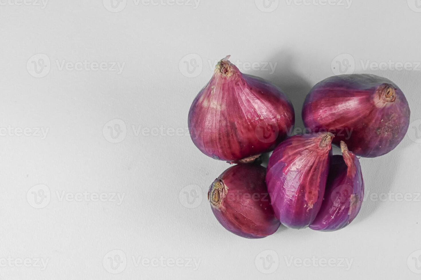 red onion, shallots on white background photo