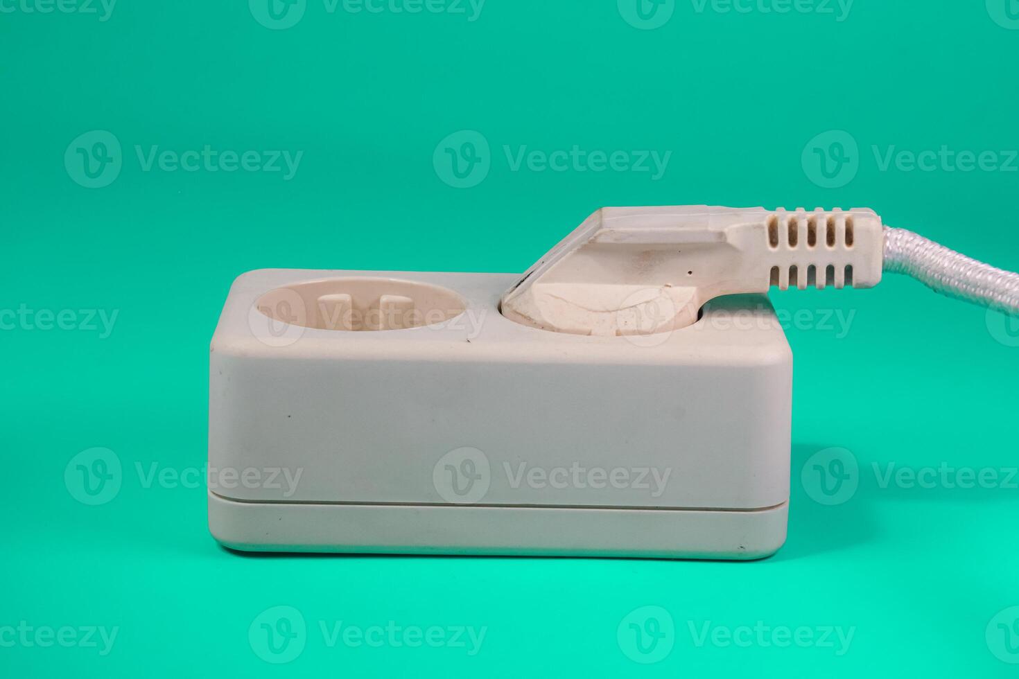 socket and plug isolated on green photo