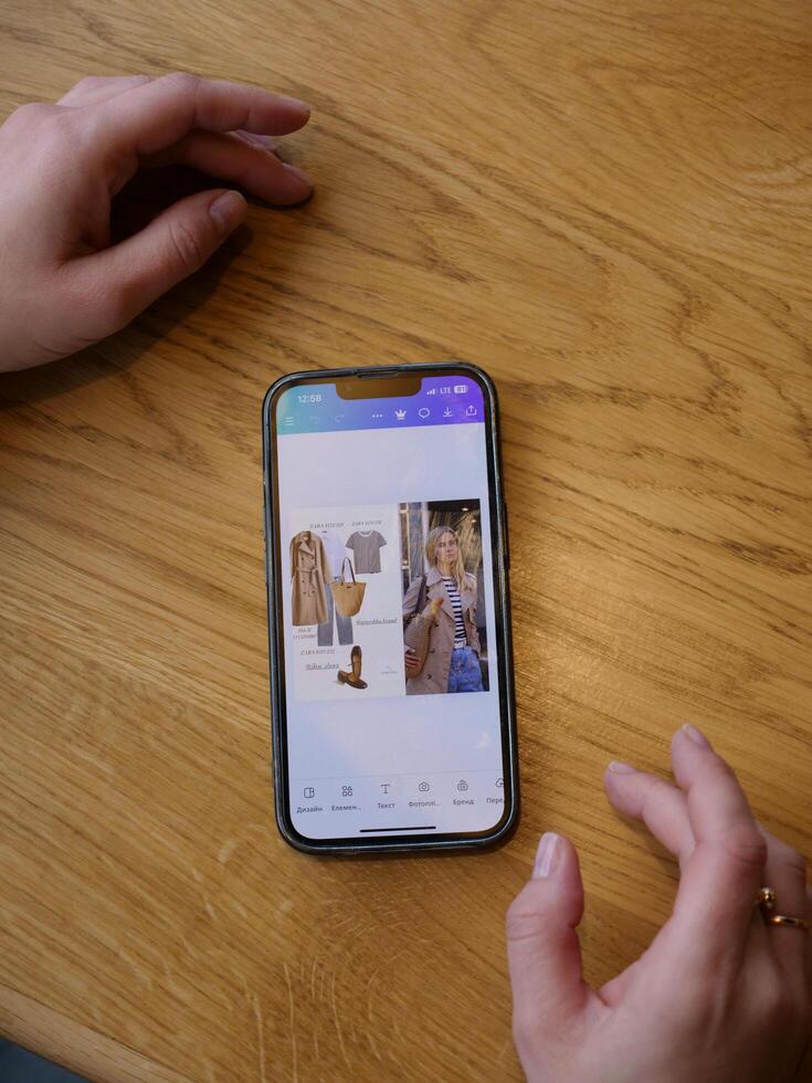A person holding a smartphone with a photo on it