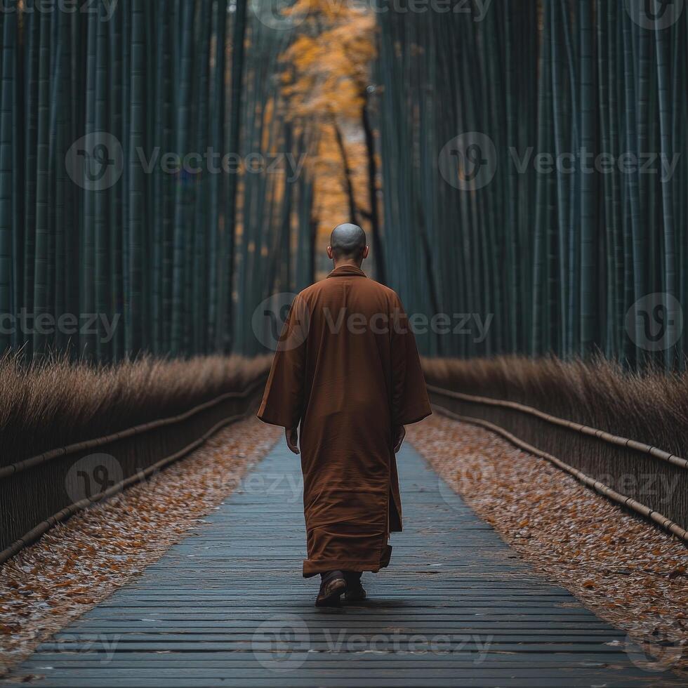 A monk walking calmly through a serene bamboo forest in autumn photo