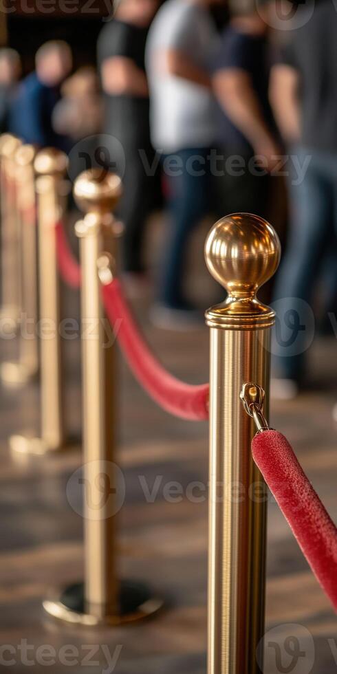 Crowd control barriers with red ropes in a busy venue photo