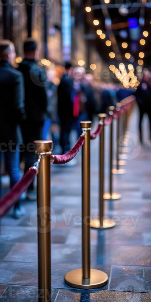 Long queue of people waiting in a dimly lit venue during evening hours photo