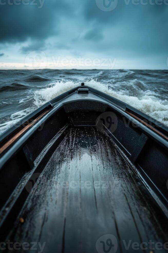 Rowboat navigating through turbulent waters at dusk near the shore photo