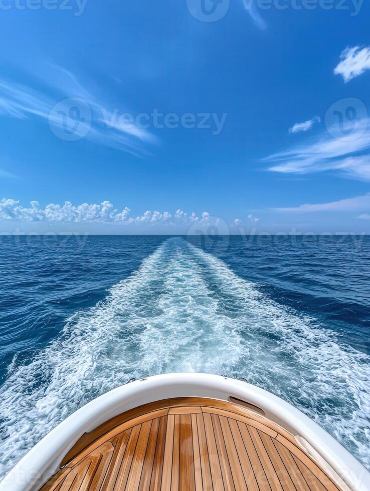 Beautiful view from the bow of a boat sailing on calm ocean waters photo