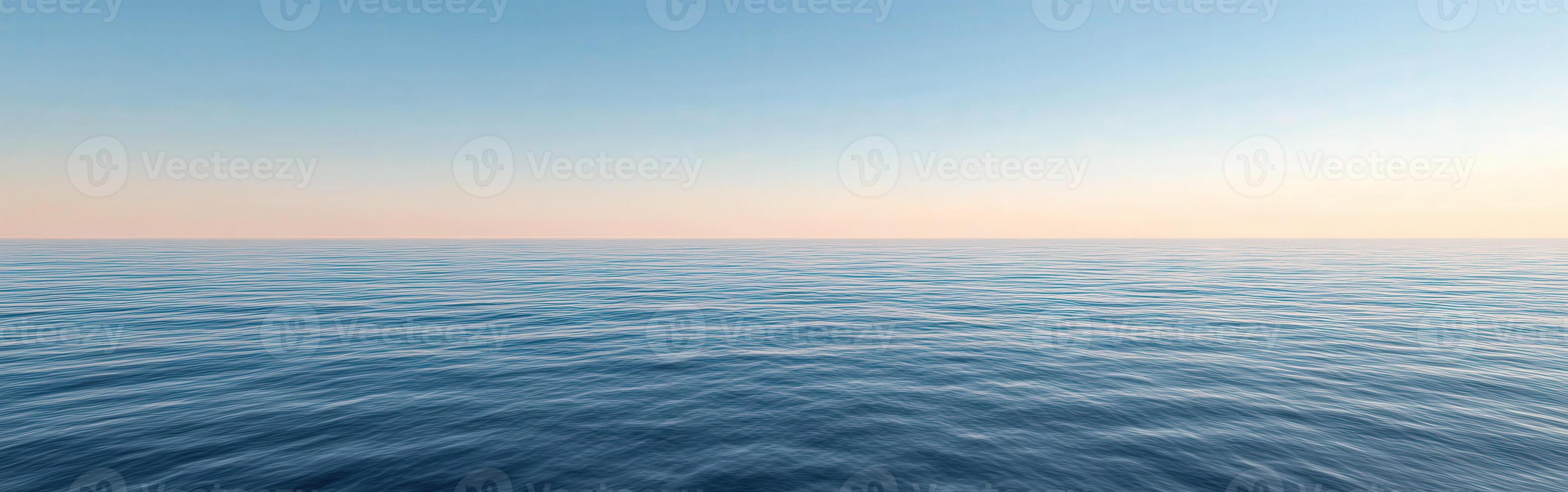 Tranquil ocean view at dusk with gentle waves and clear horizon photo