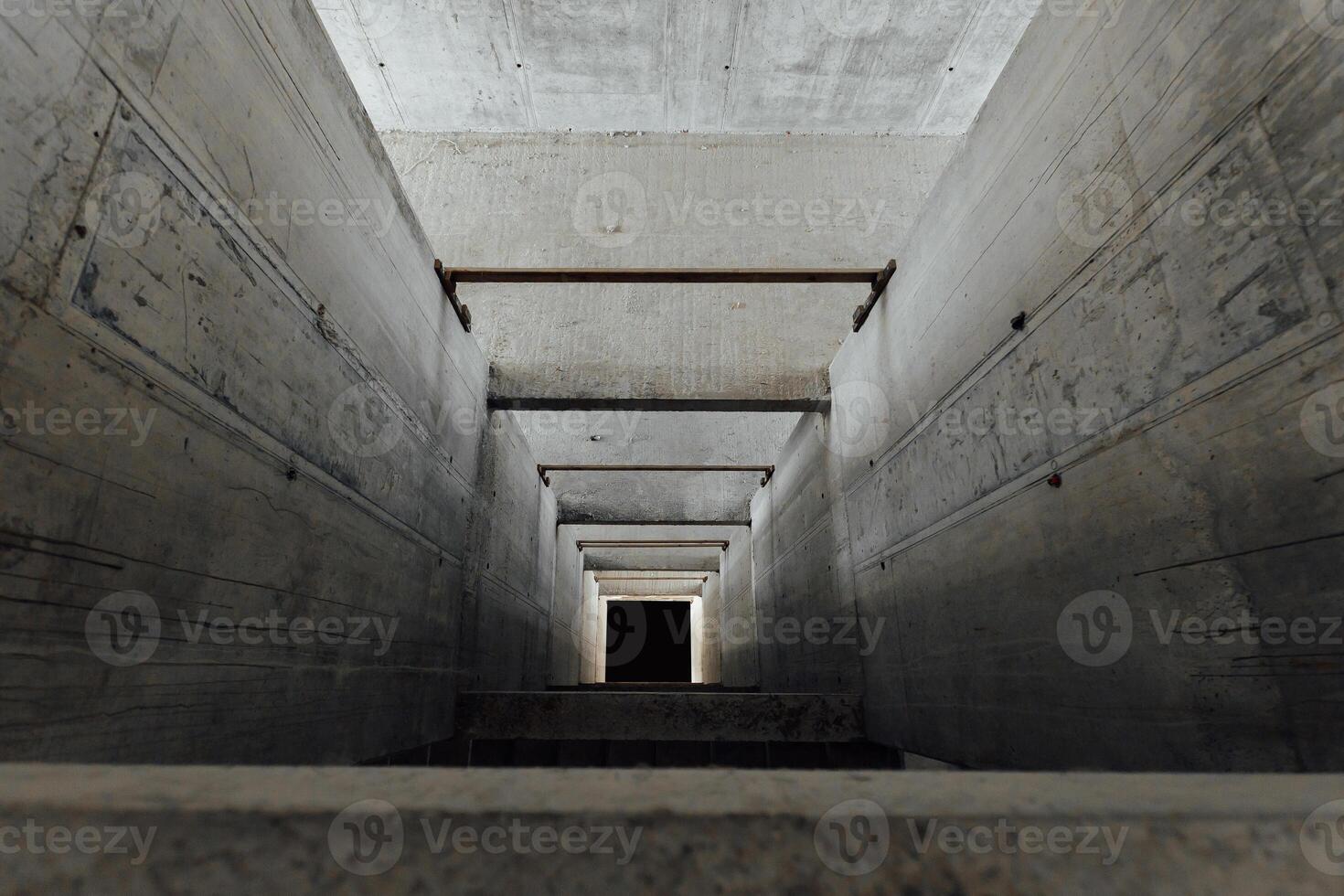 an elevator shaft made of concrete in a building under construction photo