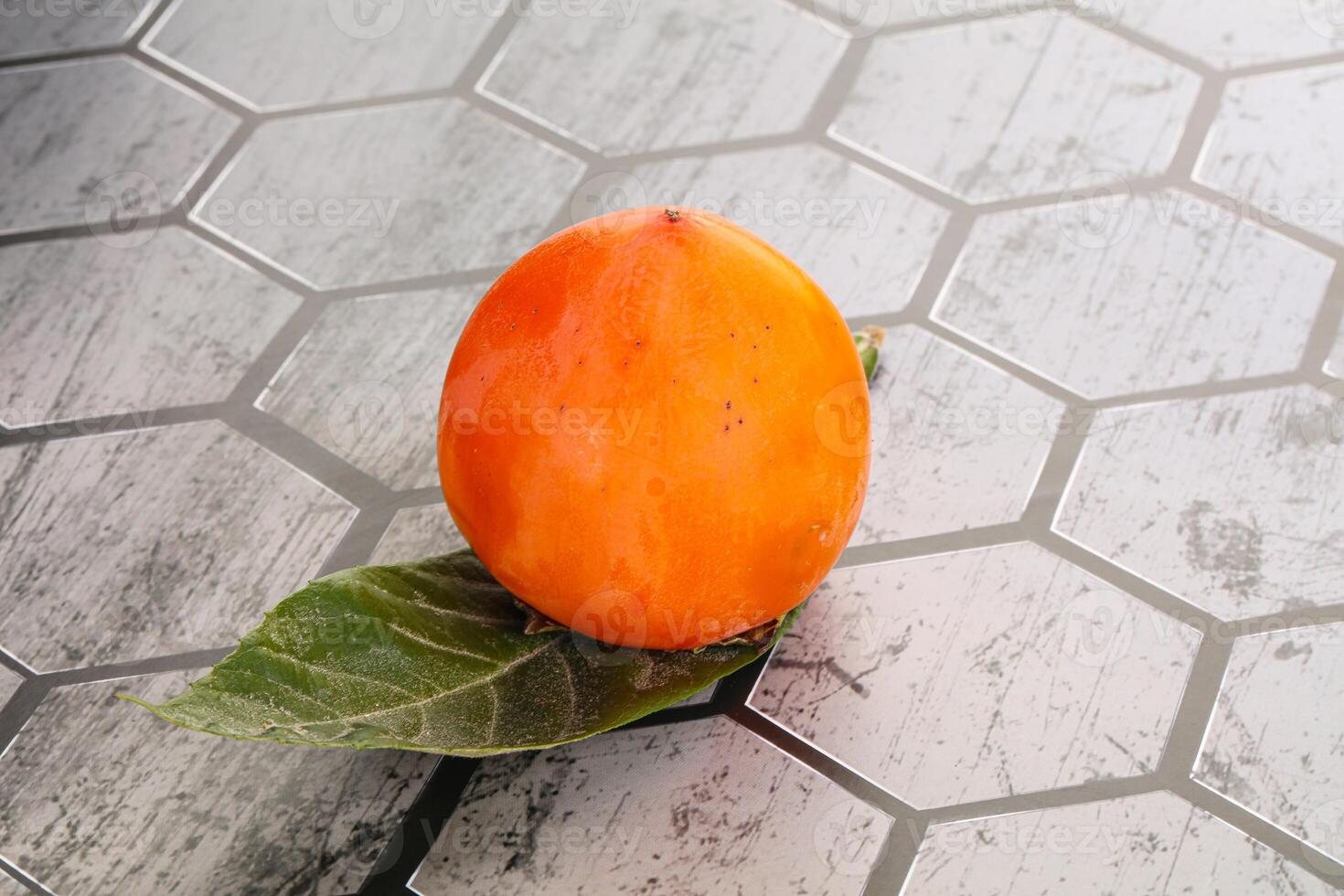 Fresh ripe sweet juicy persimmon photo