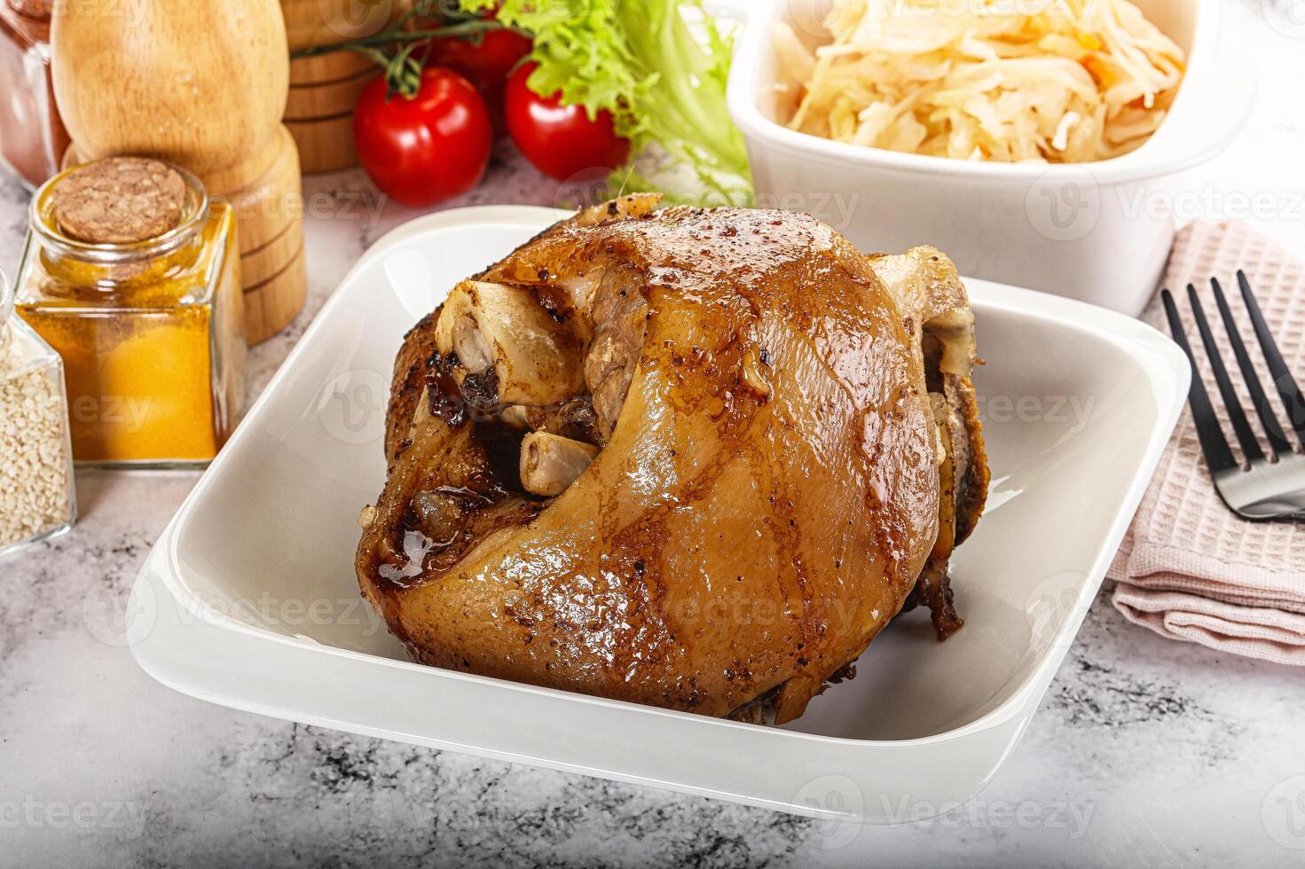 Baked pork knee with spices photo