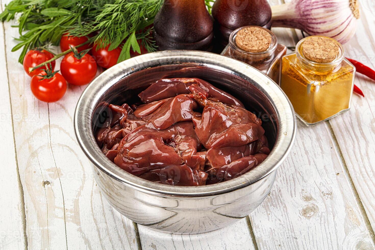 Raw chicken liver uncooked in the bowl photo