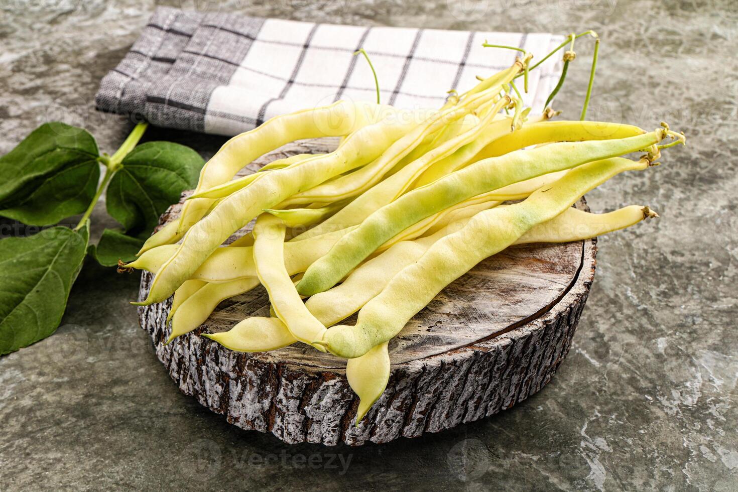 Raw green bean strings heap photo