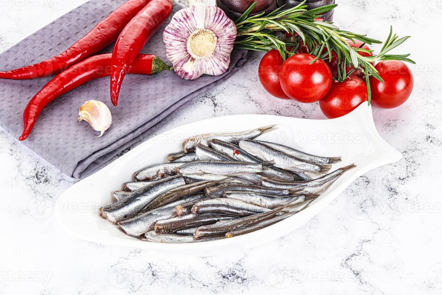 Pickled anchovy in the plate photo