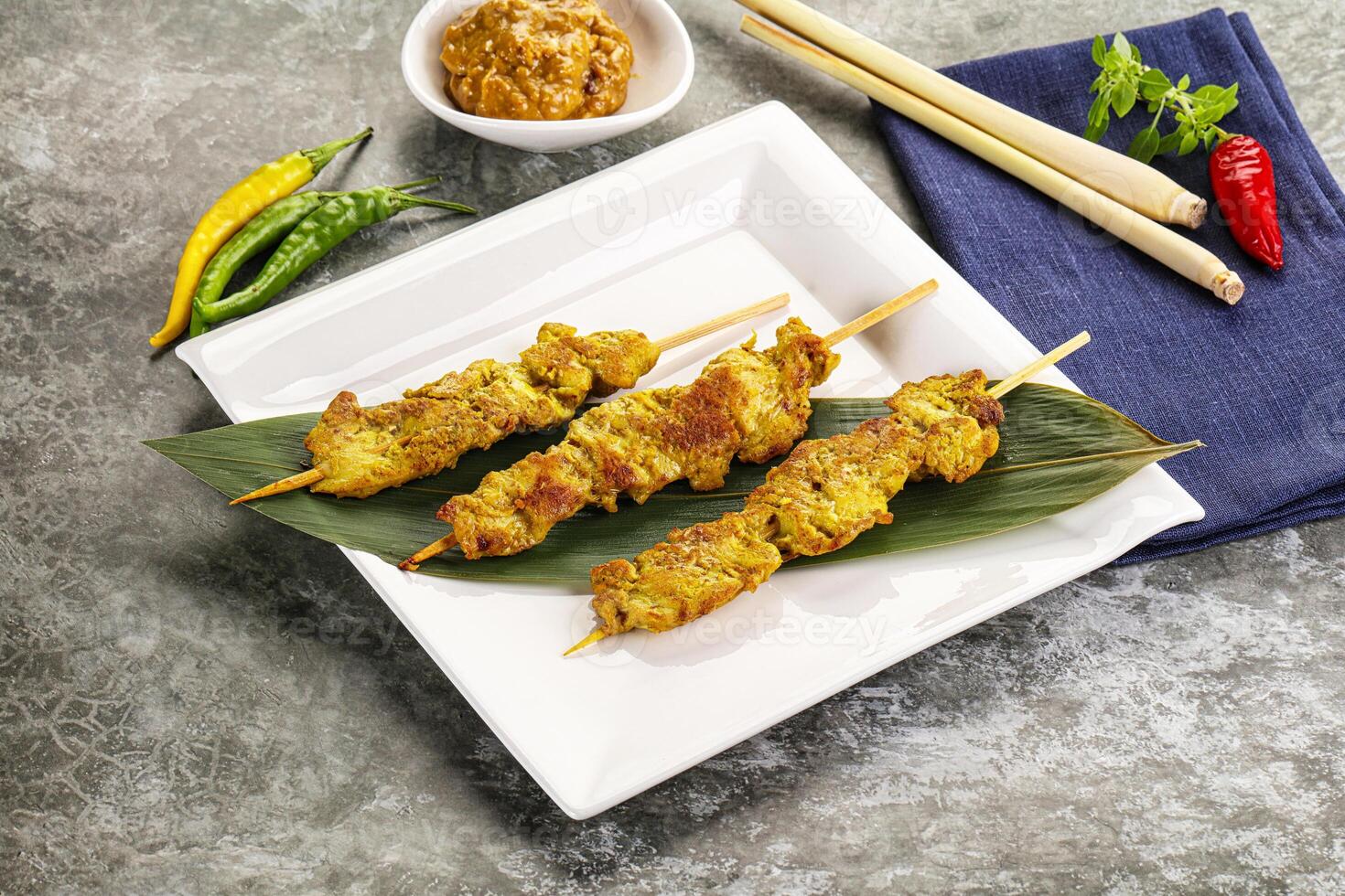 Thai meat skewer Satay with sauce photo