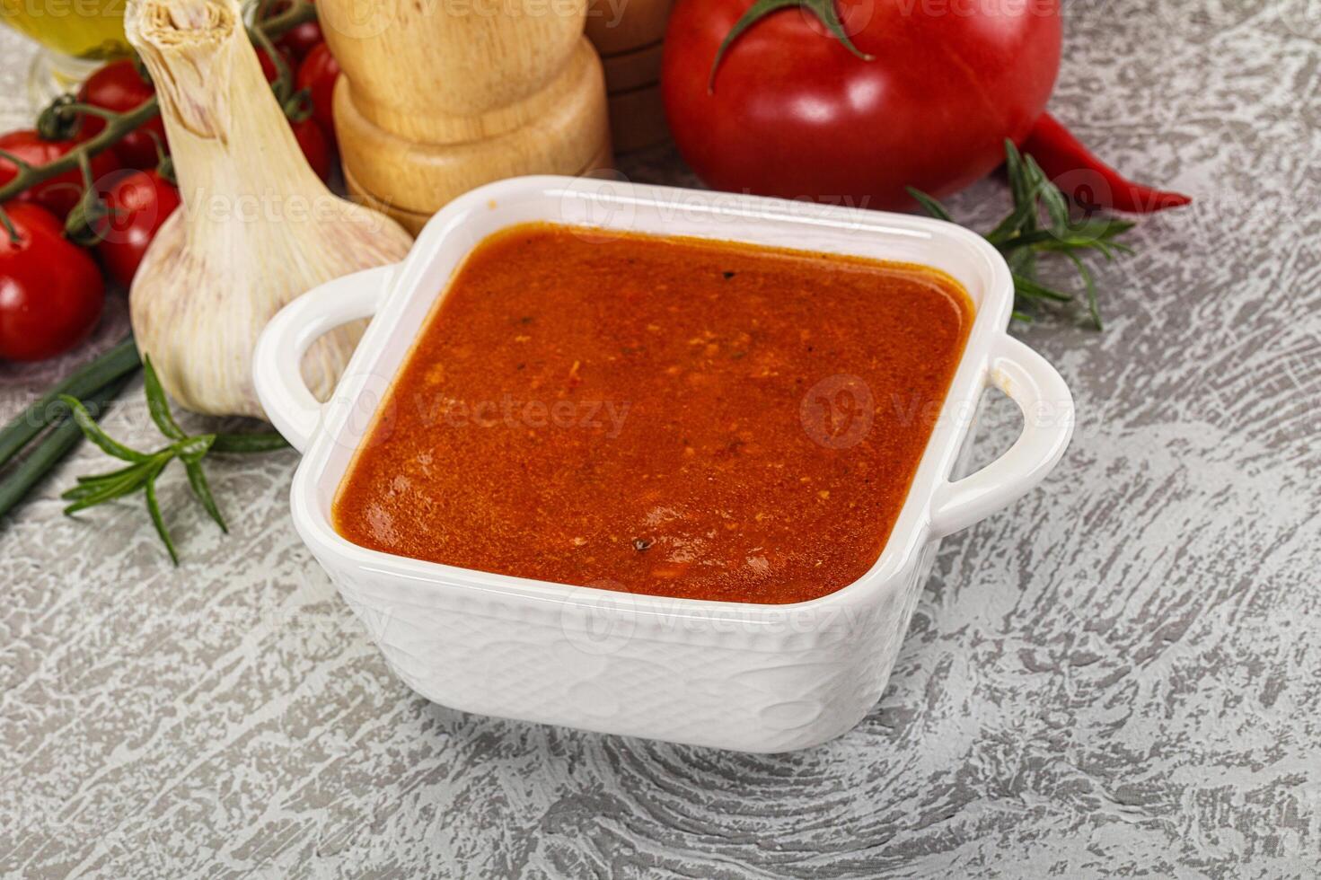 Hot tomato soup with diced chicken photo