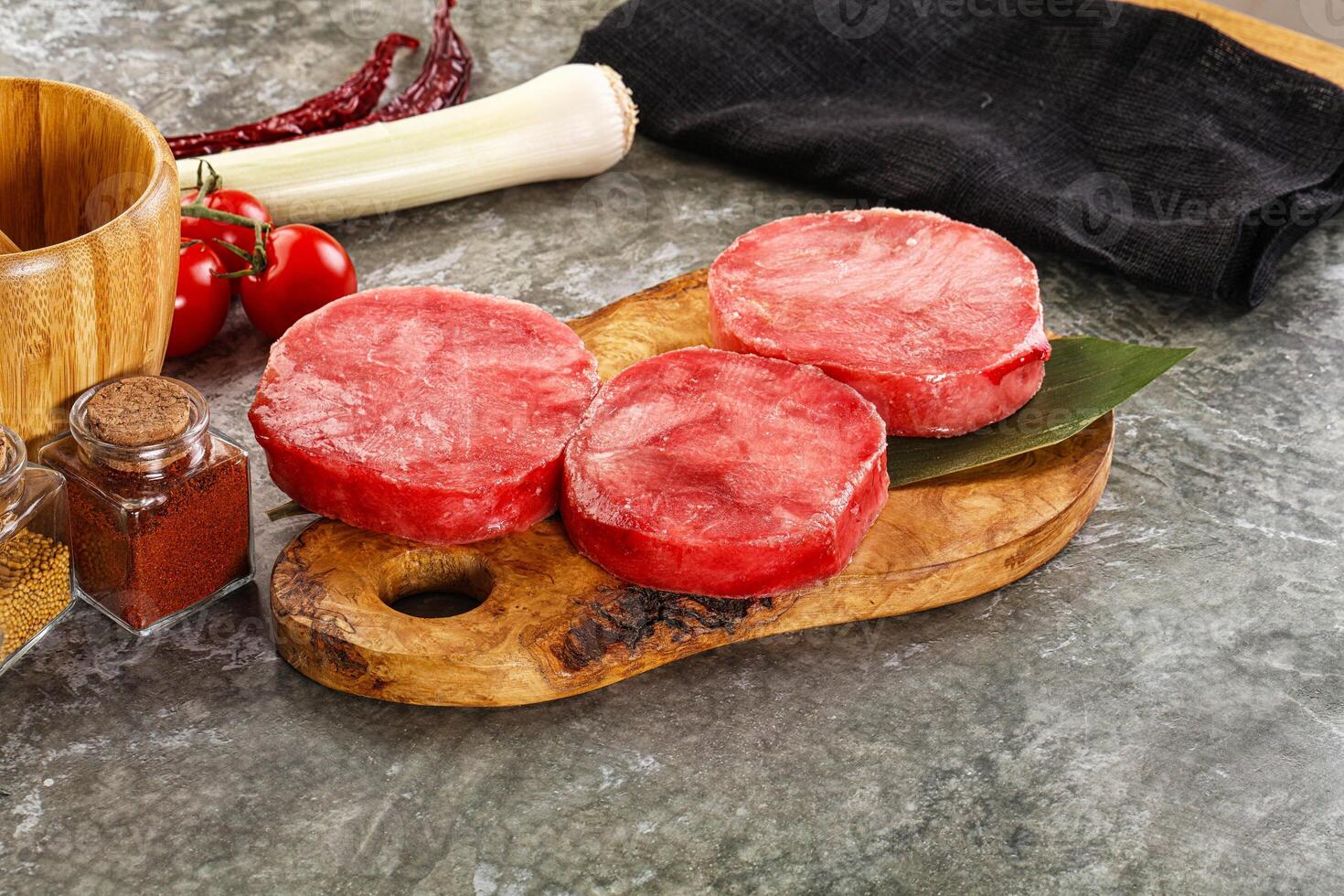 Delicous raw tuna medallion for cooking photo