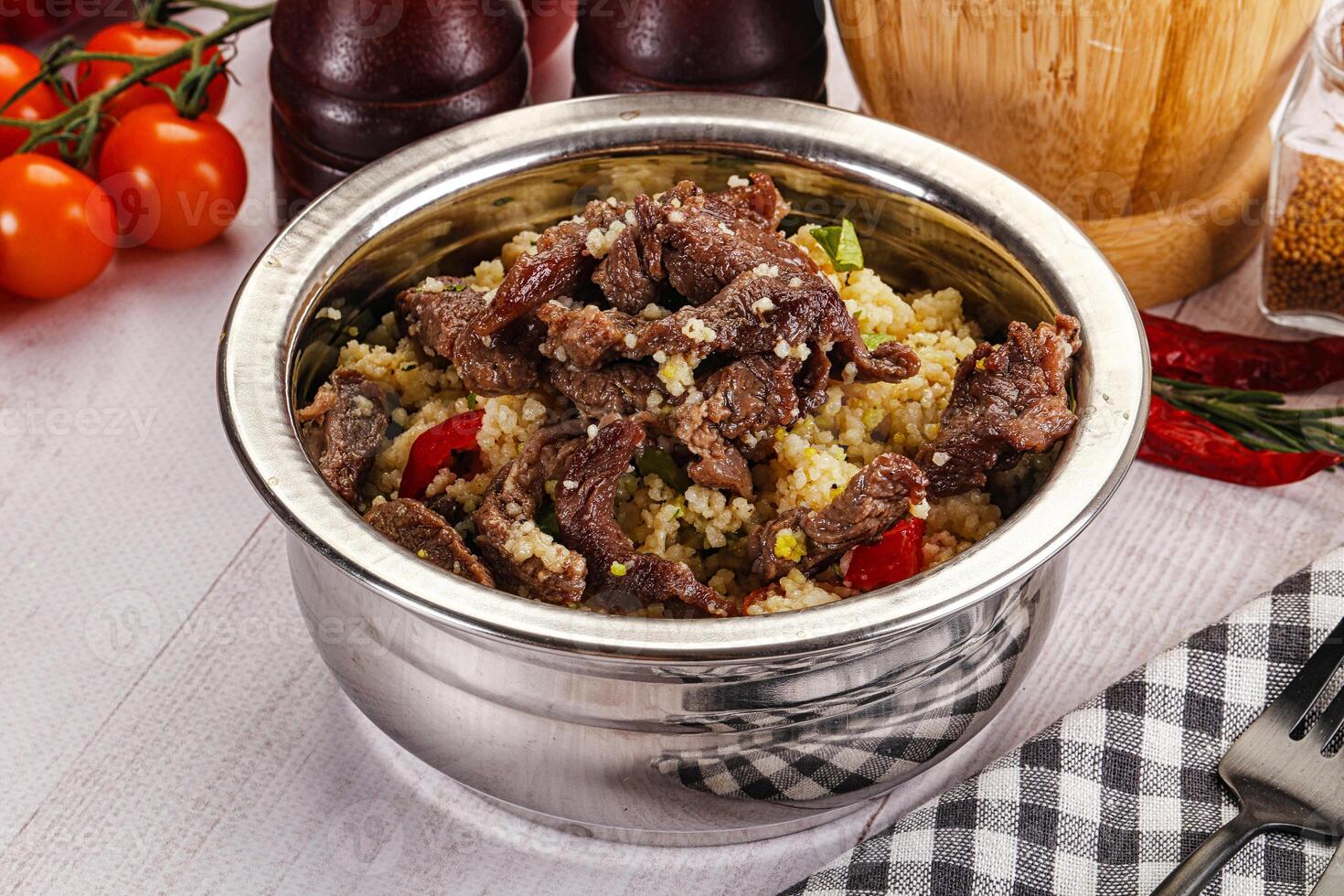Traditional couscous with beef and vegetables photo