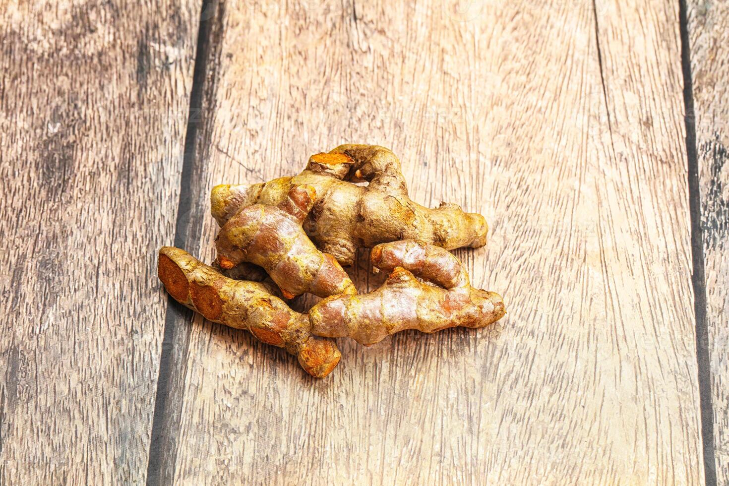 Fresh young Tumeric root heap photo