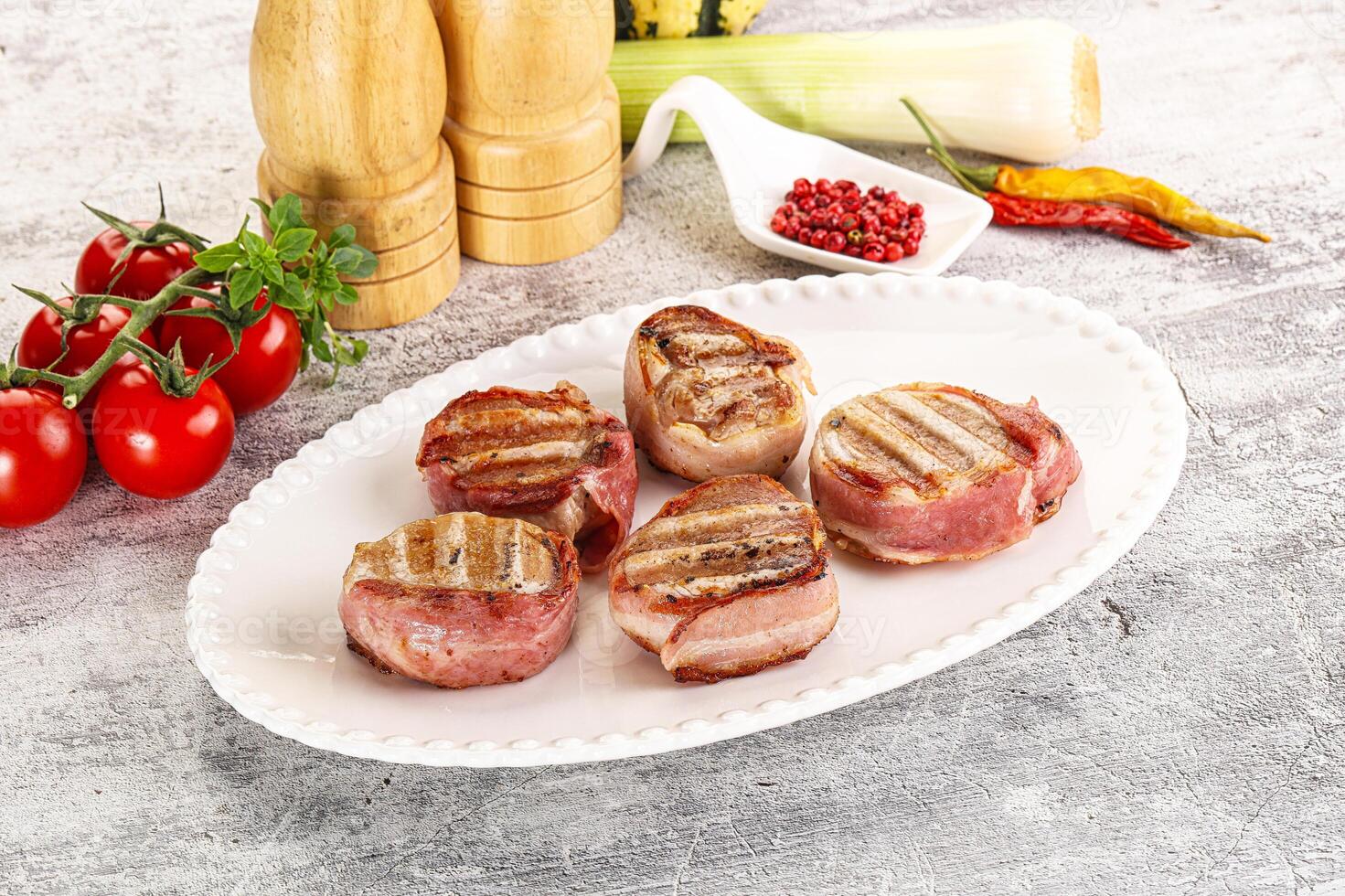 Grilled pork tenderloin with bacon photo