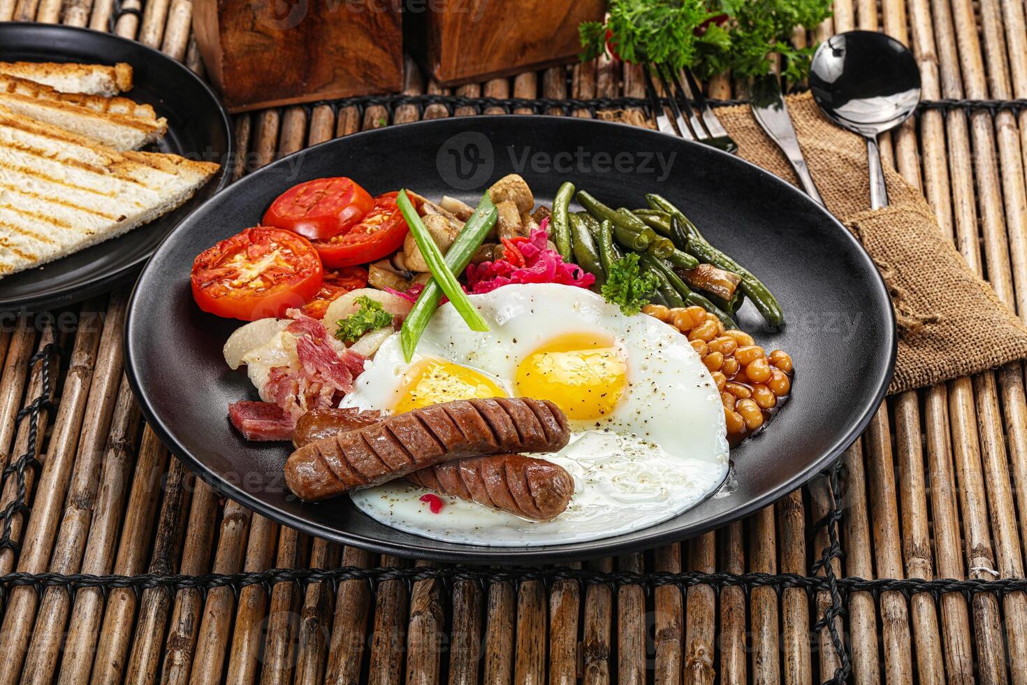 Traditional Engrlish breakfast with egg and sausages photo