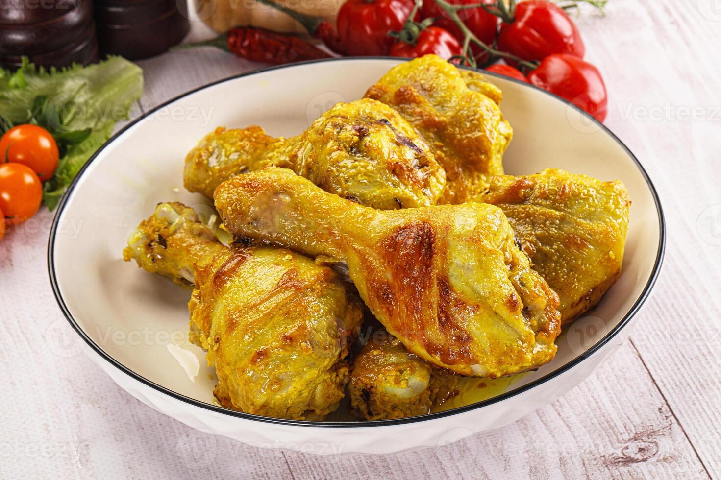 Roasted Chicken leg drumsticks with curry sauce photo