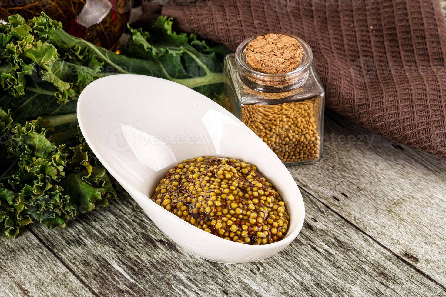 Mustard sauce with seeds in the bowl photo