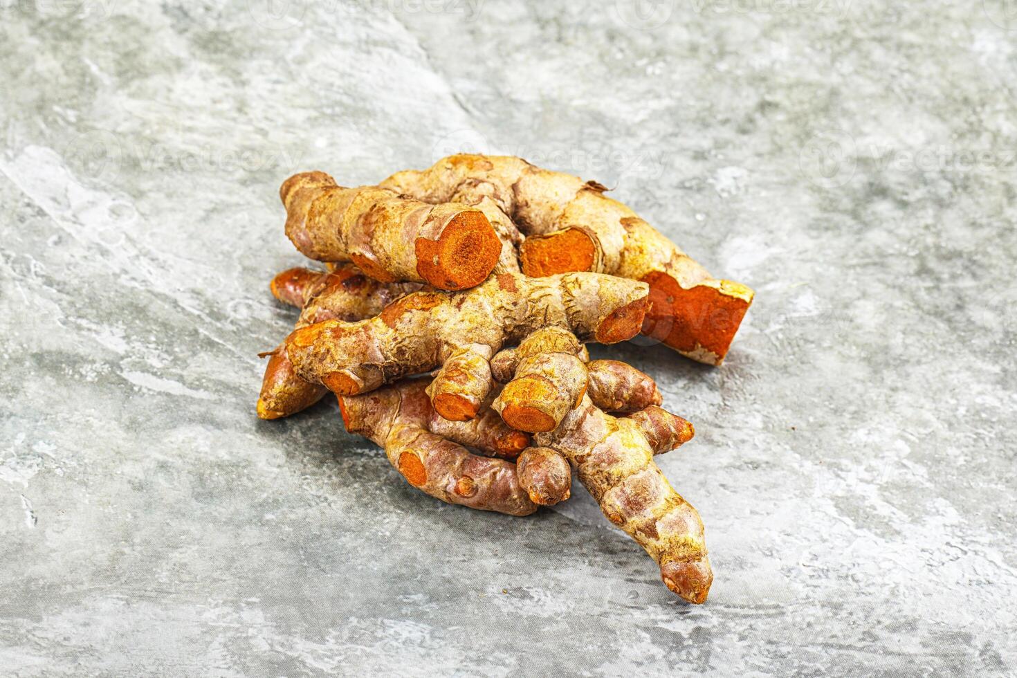 Fresh young Tumeric root heap photo