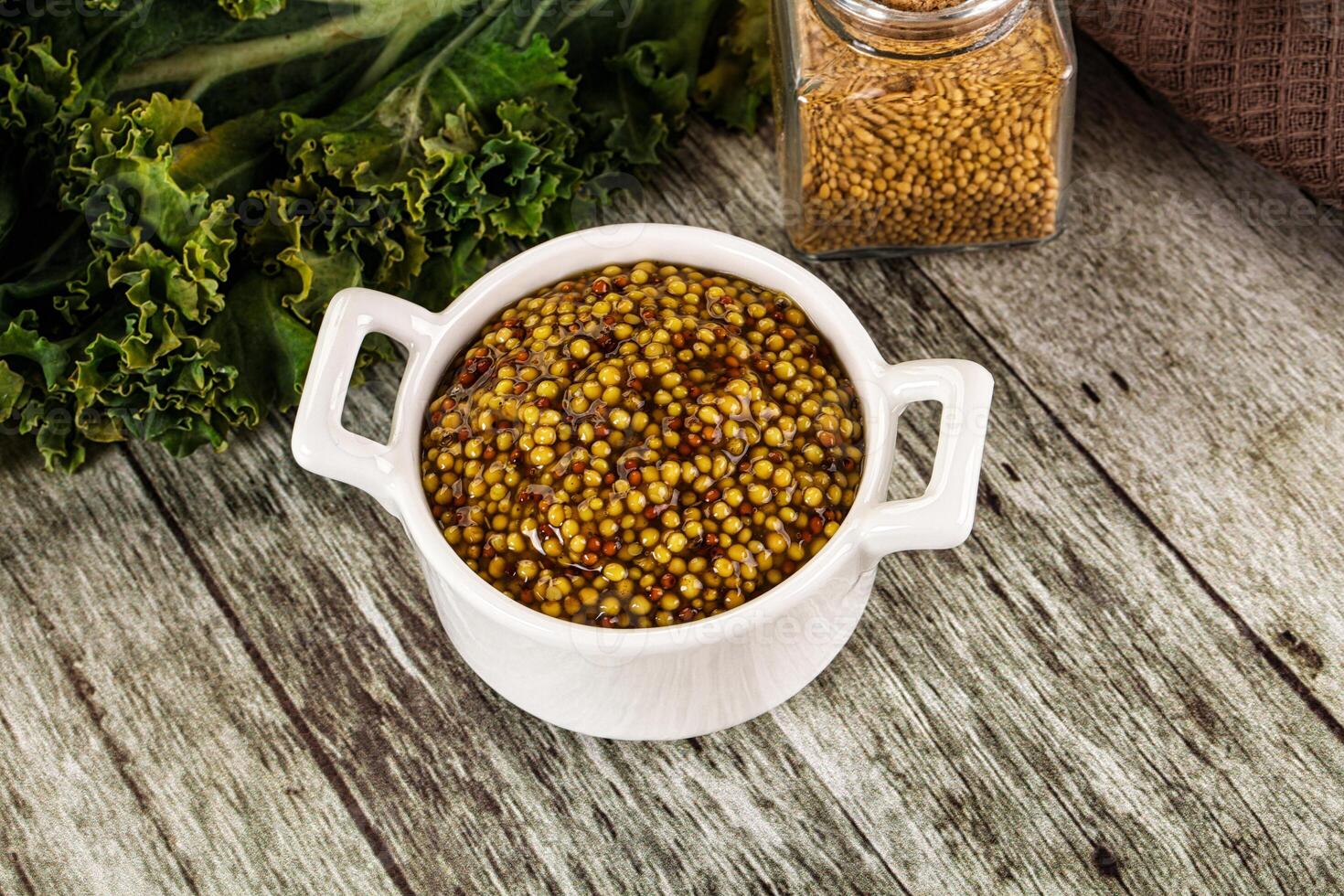 Mustard sauce with seeds in the bowl photo