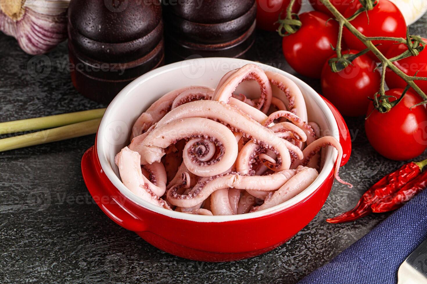 Delicous marinated squid tentacles in the bowl photo