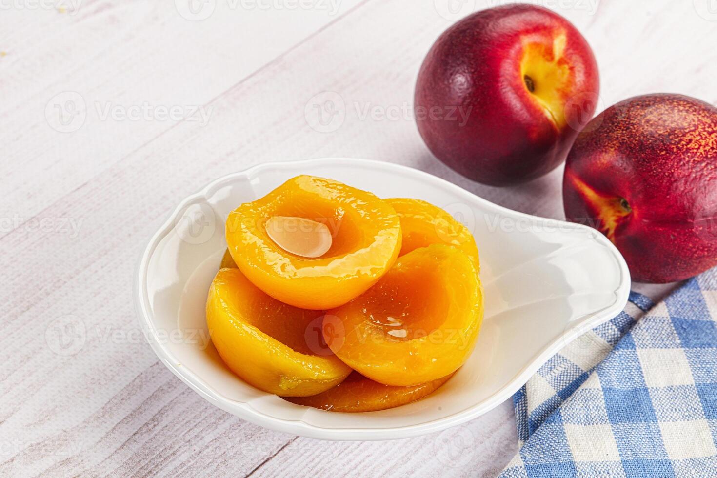 Canned peaches with sweet syrope photo