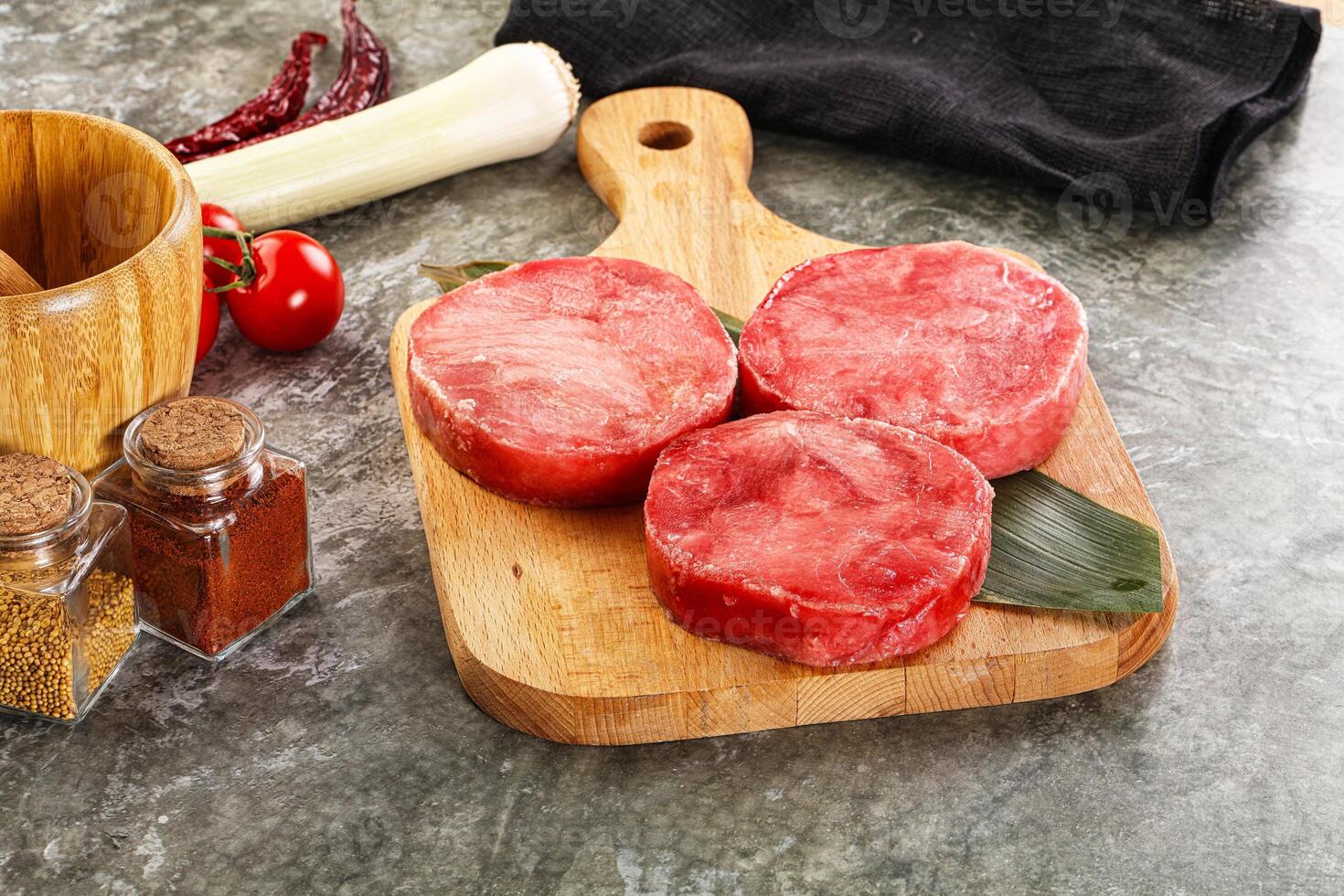 Delicous raw tuna medallion for cooking photo