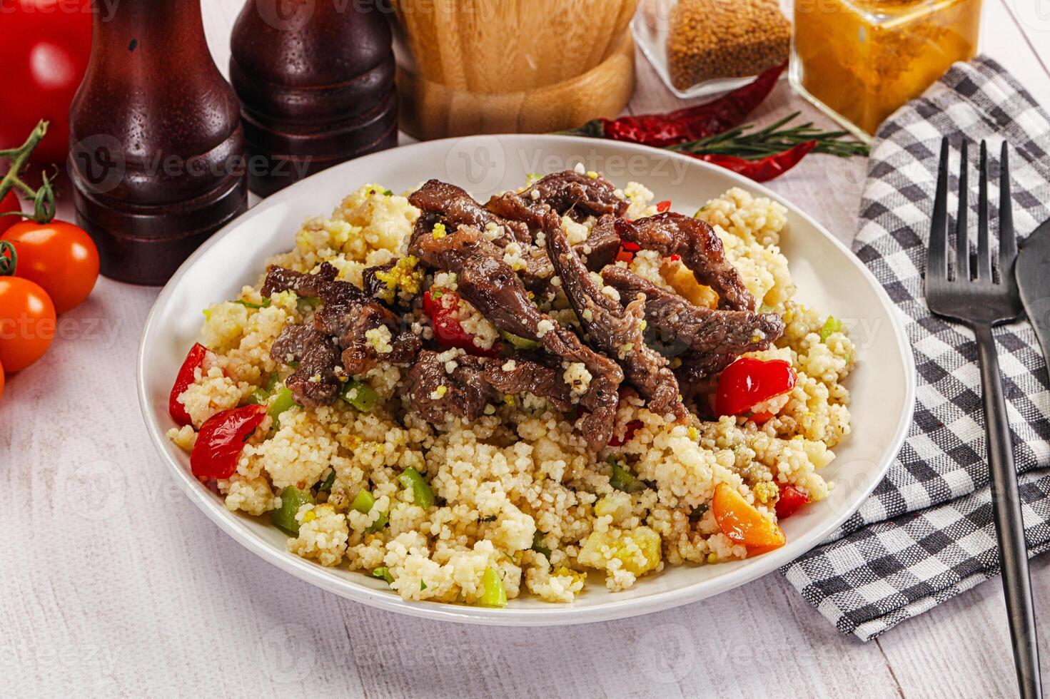 Traditional couscous with beef and vegetables photo