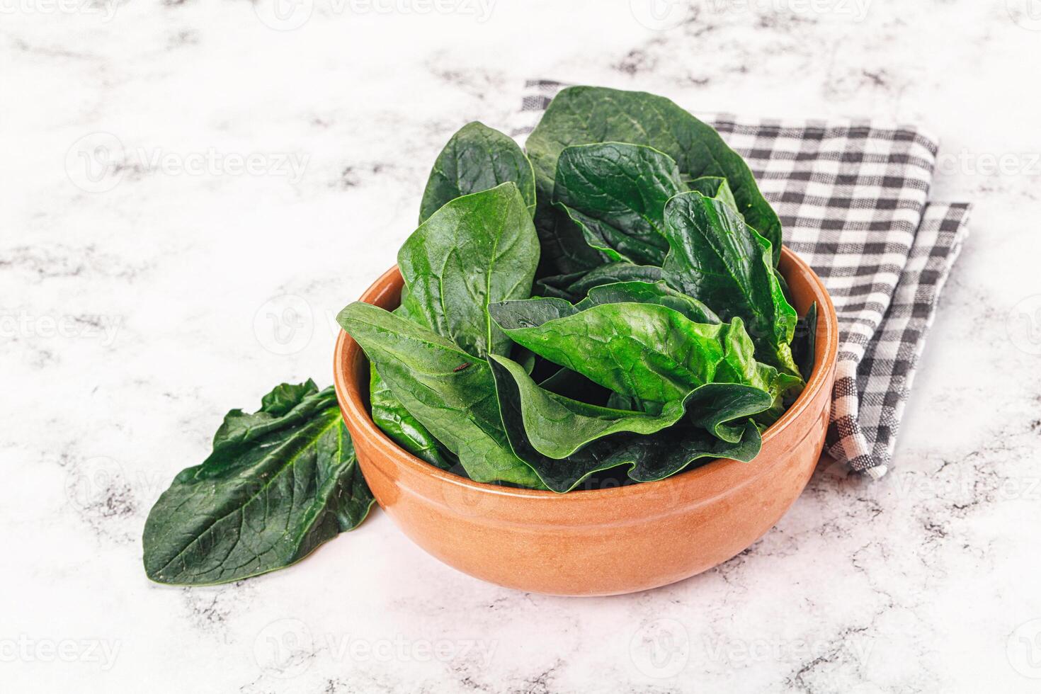 Ripe green spinach leaves heap photo