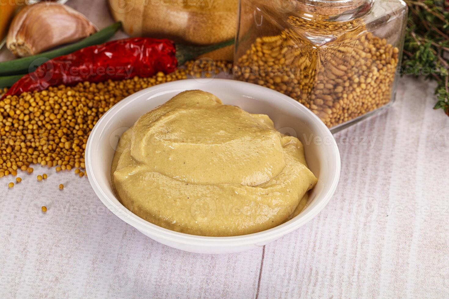 Dijon mustard sauce in the bowl photo