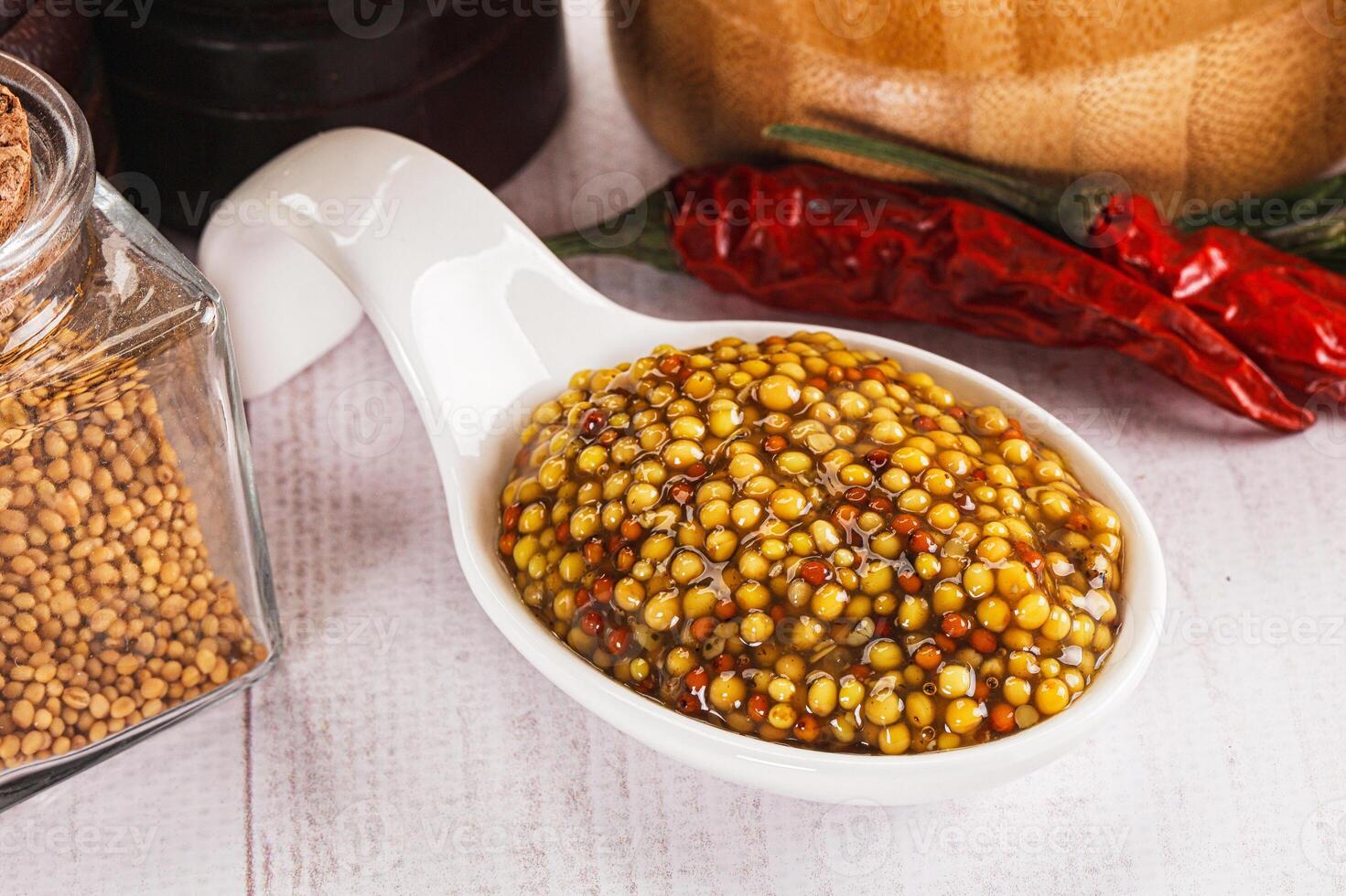 Spicy mustard sauce with seeds photo