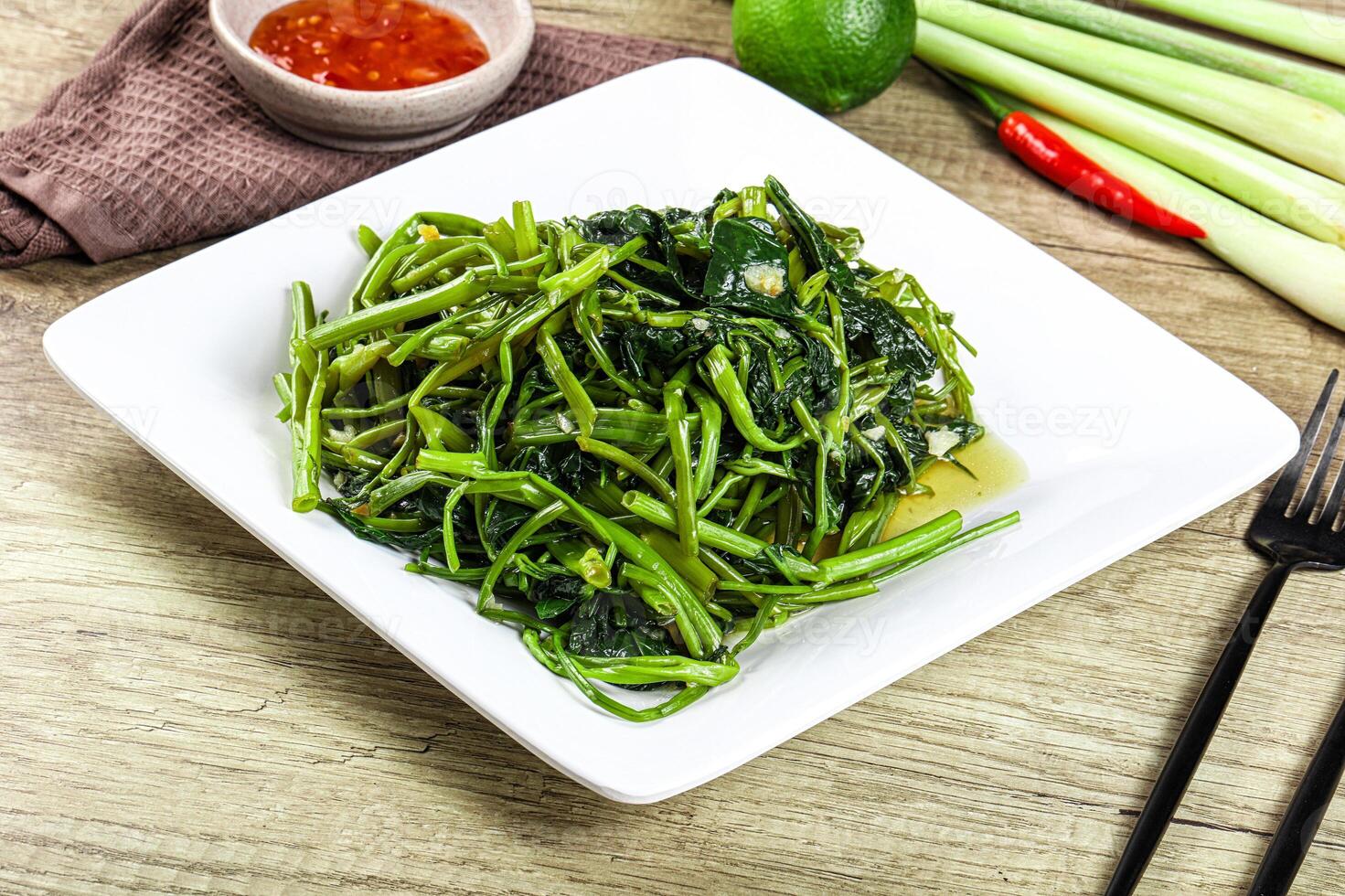 Asian cuisine stir fried morning glory photo