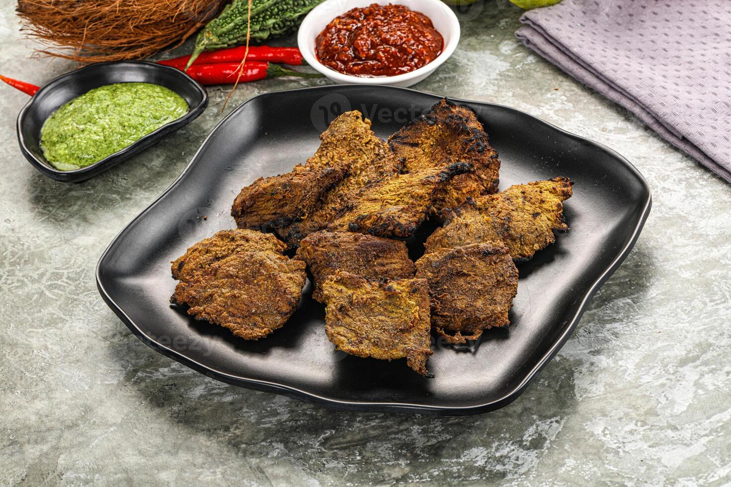 Grilled beef barbecue with spises photo