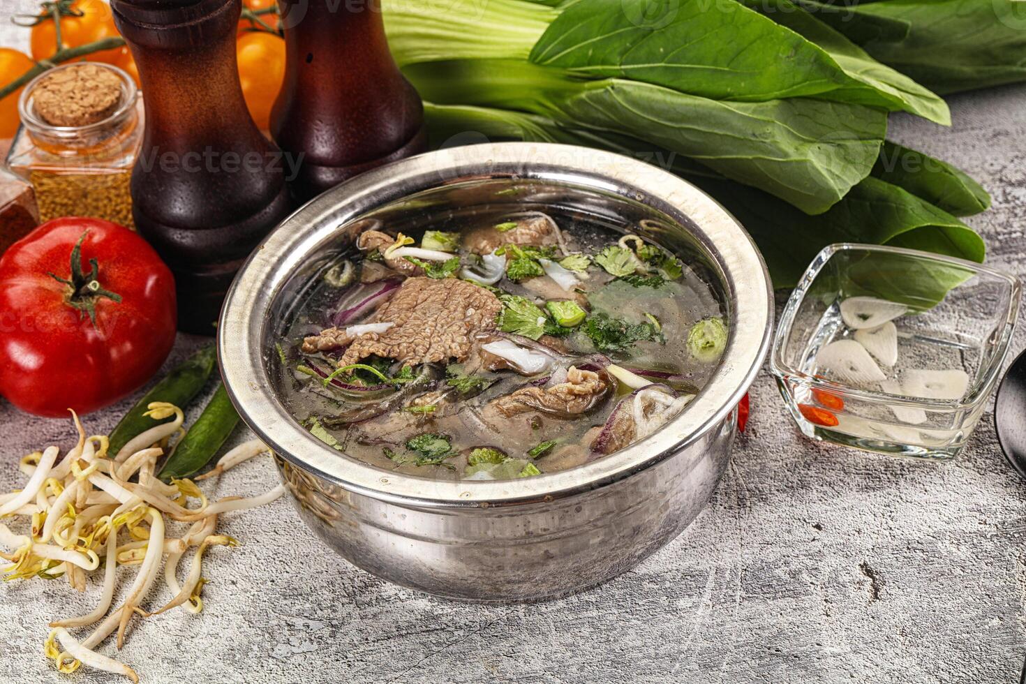 Vietnamese cuisine - Pho Bo soup with beef photo