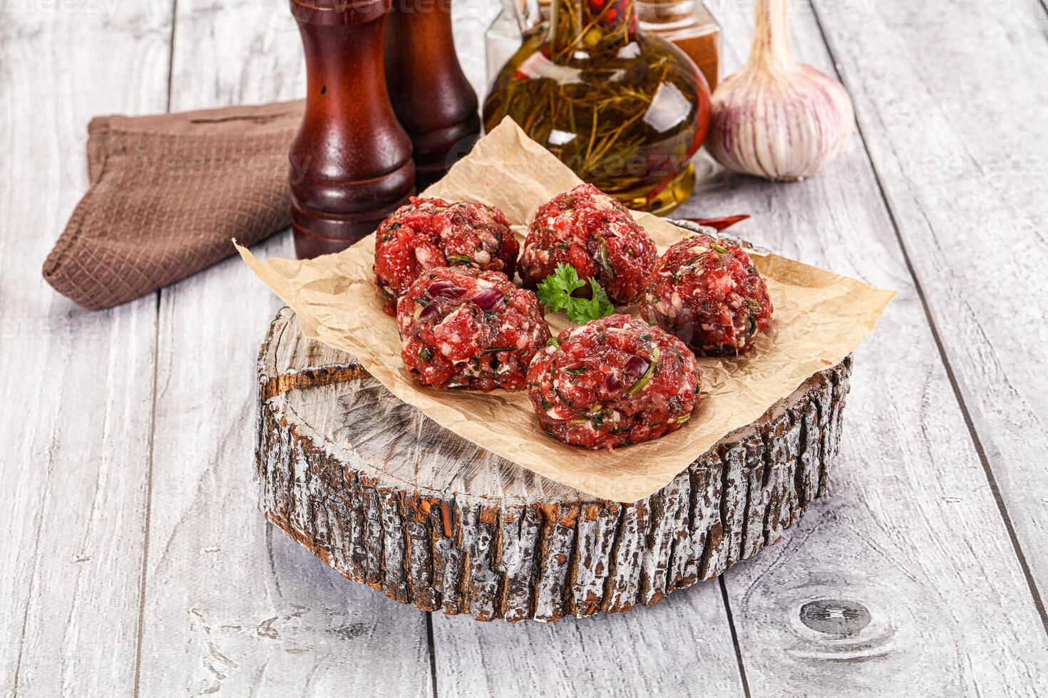 Raw beef meatballs for cooking photo