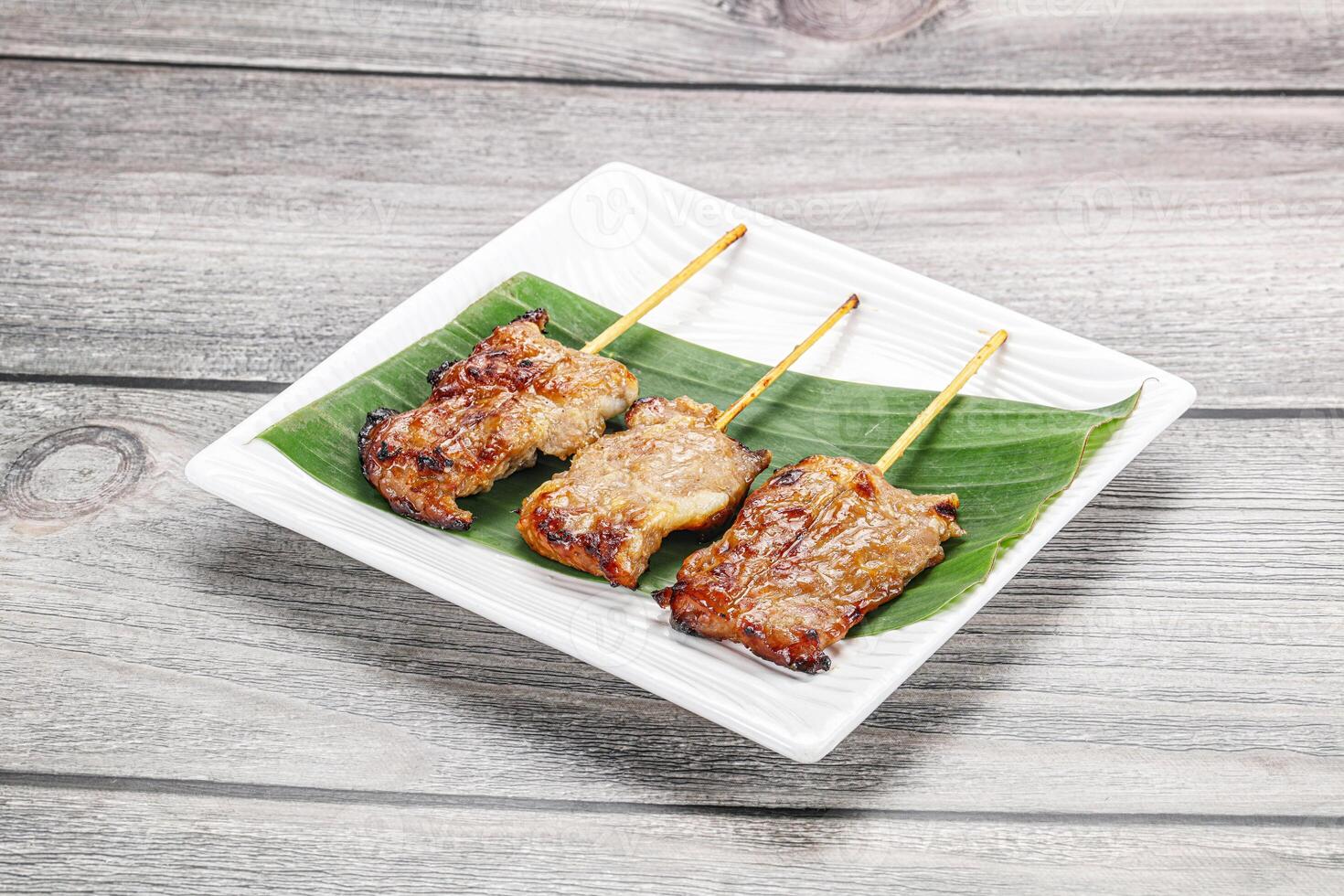 Thai cuisine - grilled pork skewer photo