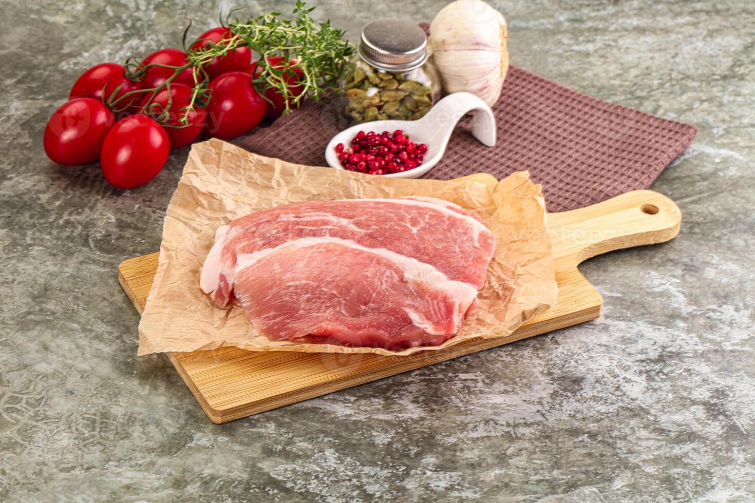 Raw pork steak for cooking photo