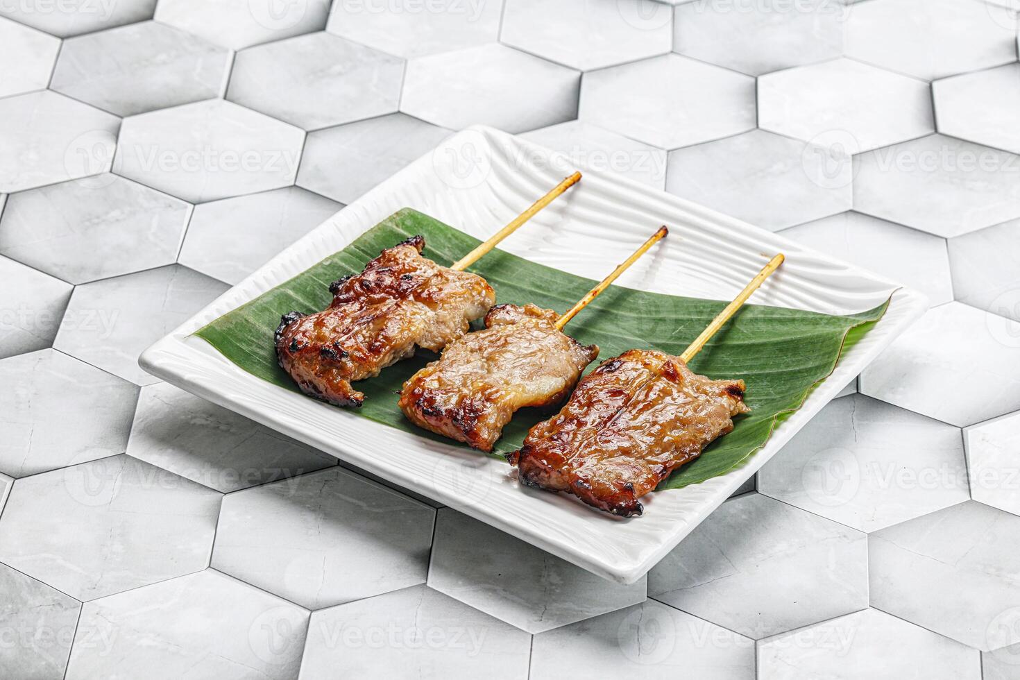 Thai cuisine - grilled pork skewer photo