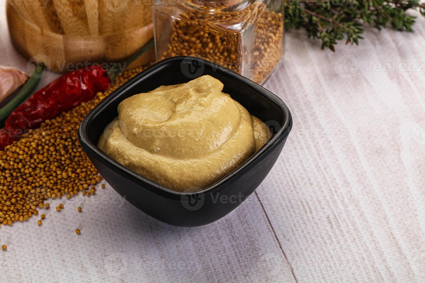 Dijon mustard sauce in the bowl photo