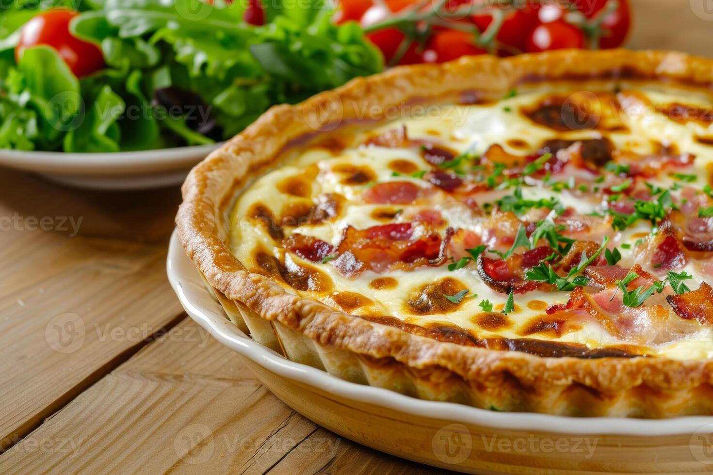 a freshly baked Quiche Lorraine on a rustic wooden table photo