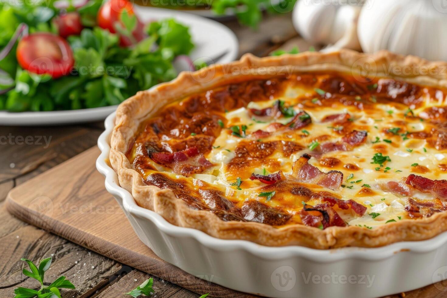 a freshly baked Quiche Lorraine on a rustic wooden table, garnished with fresh herbs photo