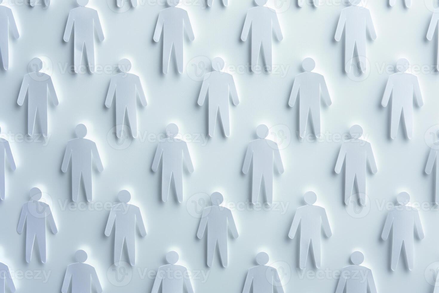 Pattern of white paper cutout people evenly spaced on a white background, creating a subtle shadow effect. photo