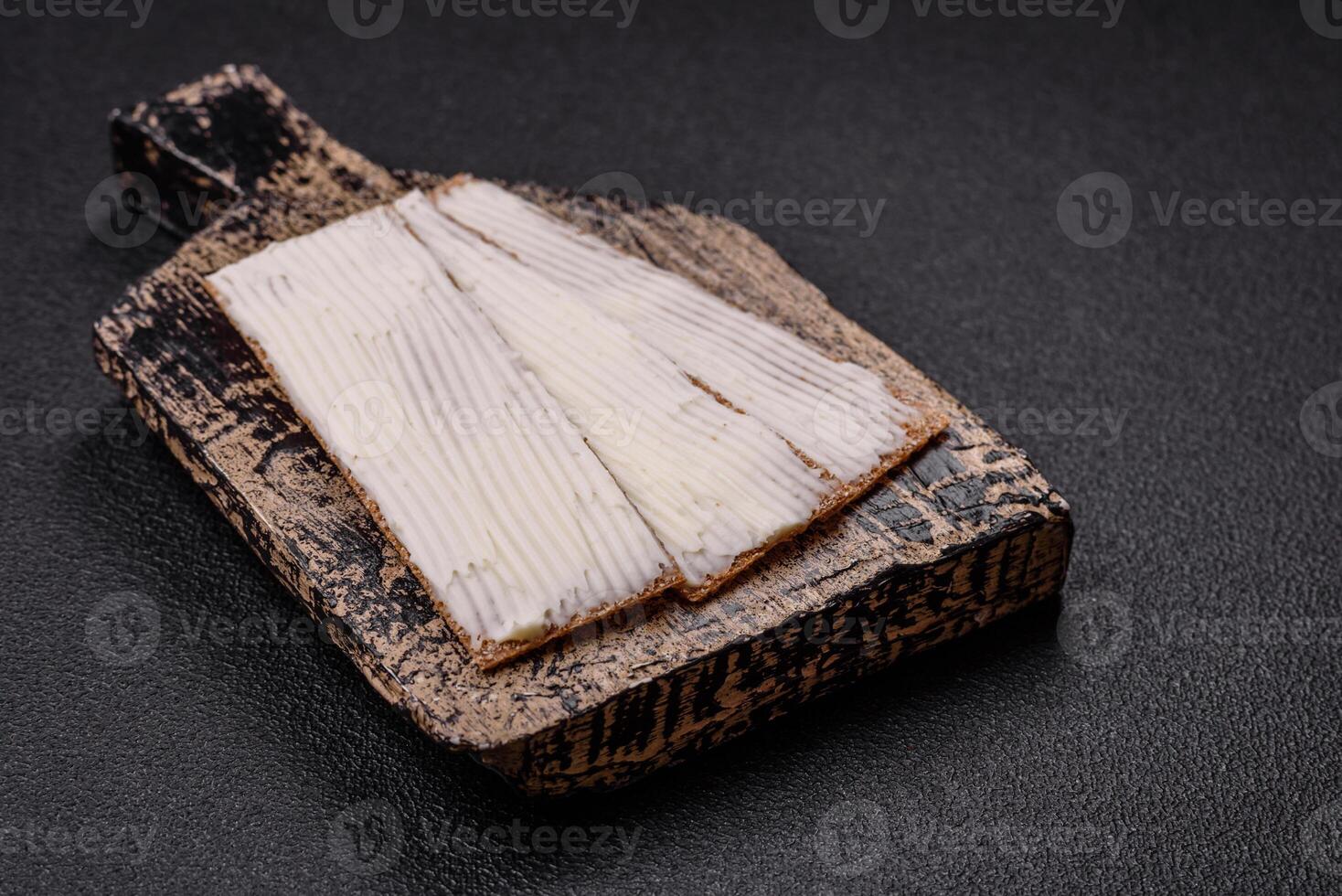 Rectangular whole grain crisp bread with cream cheese photo