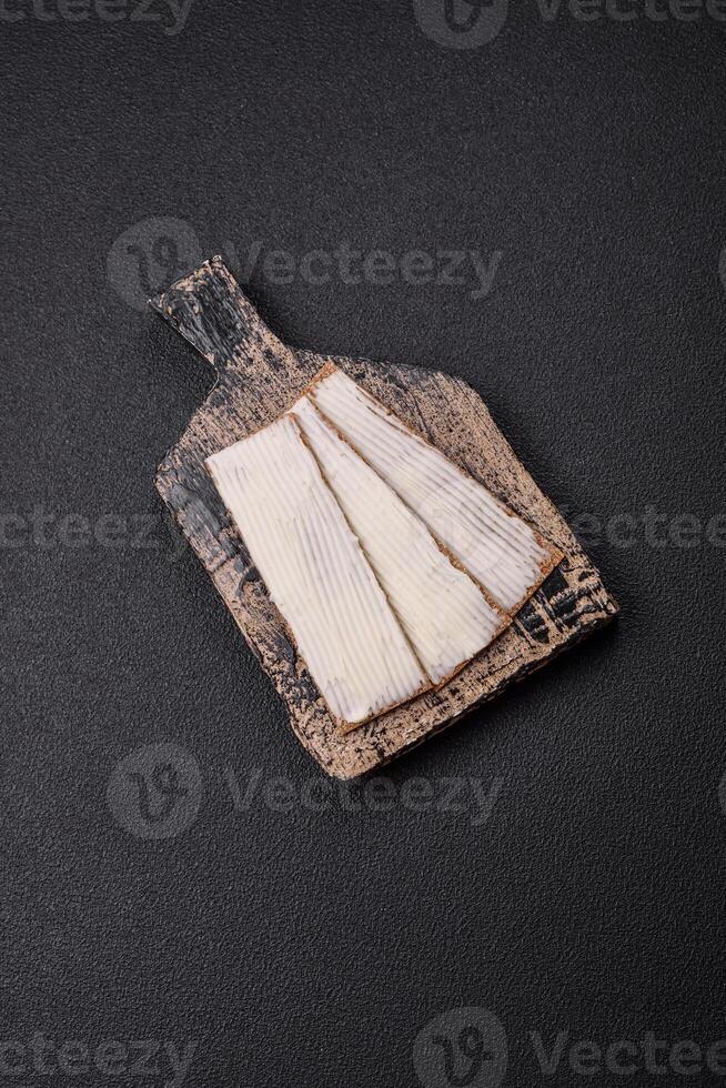 Rectangular whole grain crisp bread with cream cheese photo