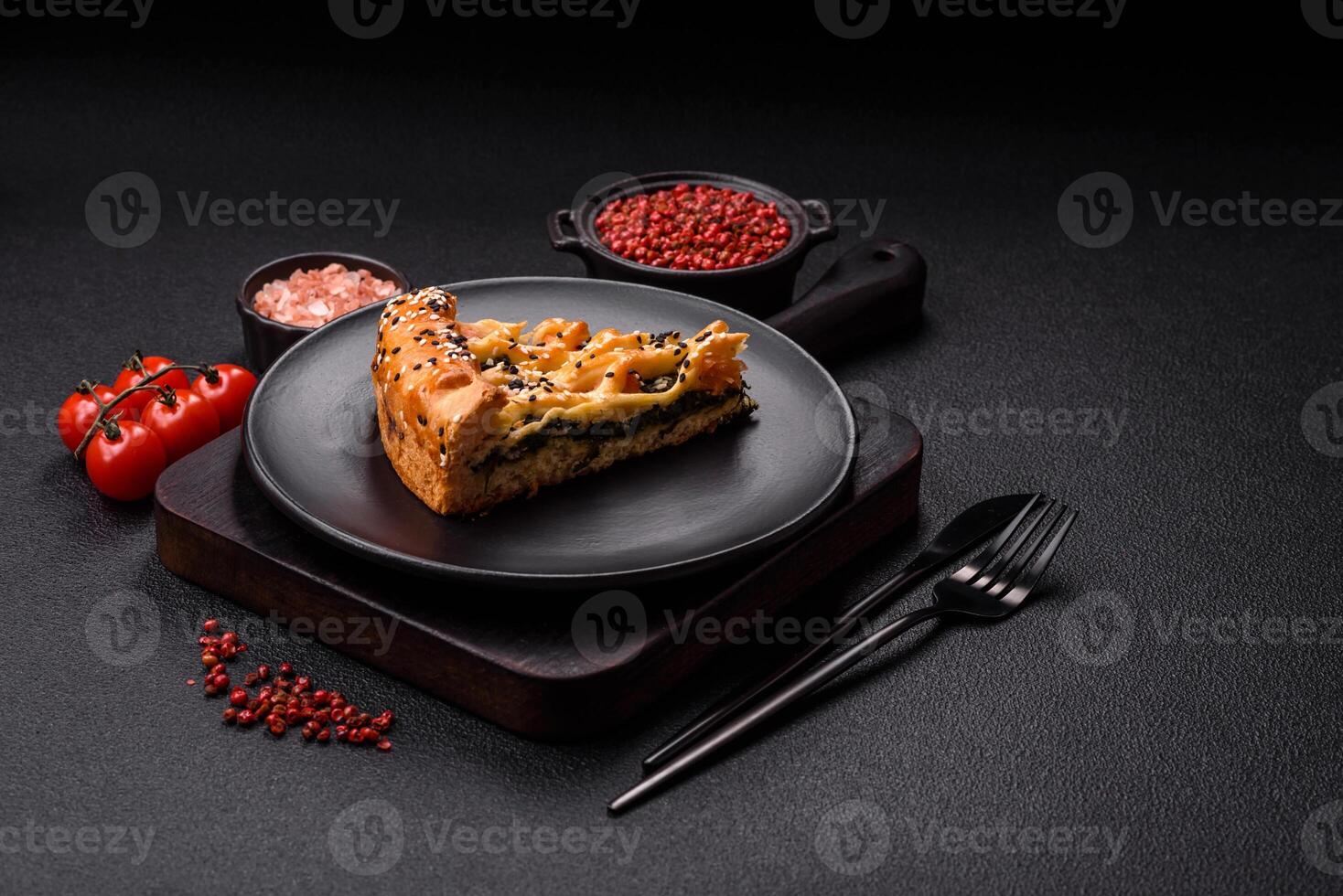 Pieces of quiche with salmon, spinach or broccoli, salt and spices photo