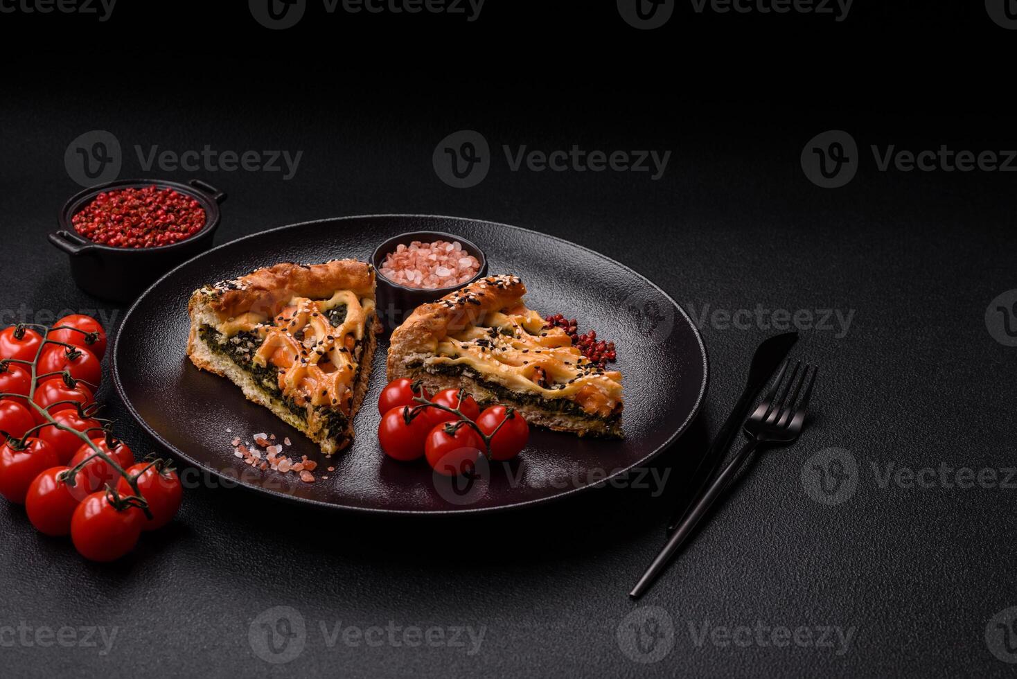 Pieces of quiche with salmon, spinach or broccoli, salt and spices photo