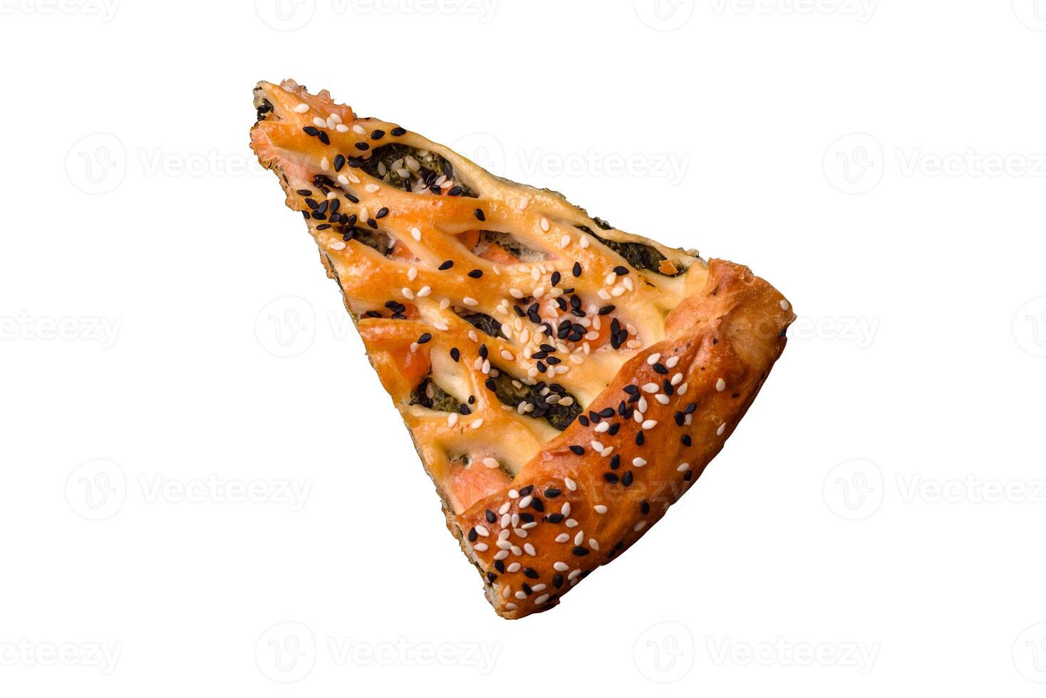 Pieces of quiche with salmon, spinach or broccoli, salt and spices photo