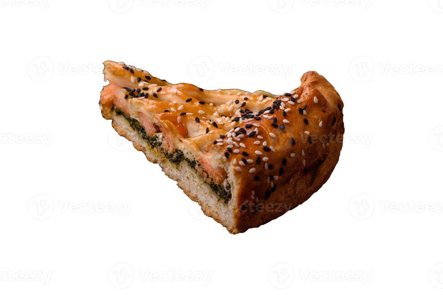Pieces of quiche with salmon, spinach or broccoli, salt and spices photo